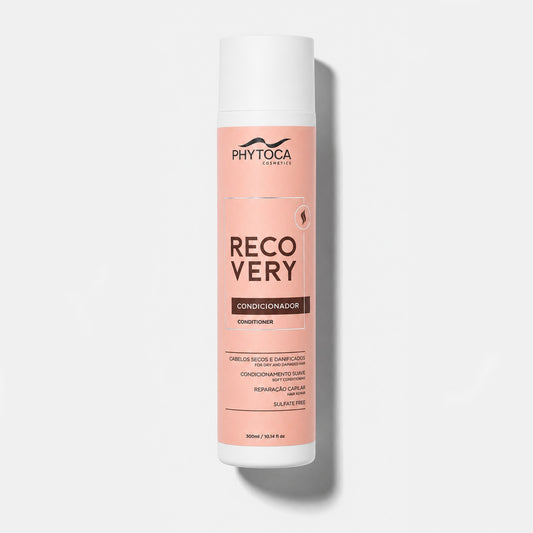 Acondicionador Phytoca USA Recovery para cabello seco y dañado en envase cilíndrico de color rosa suave de 300 ml.