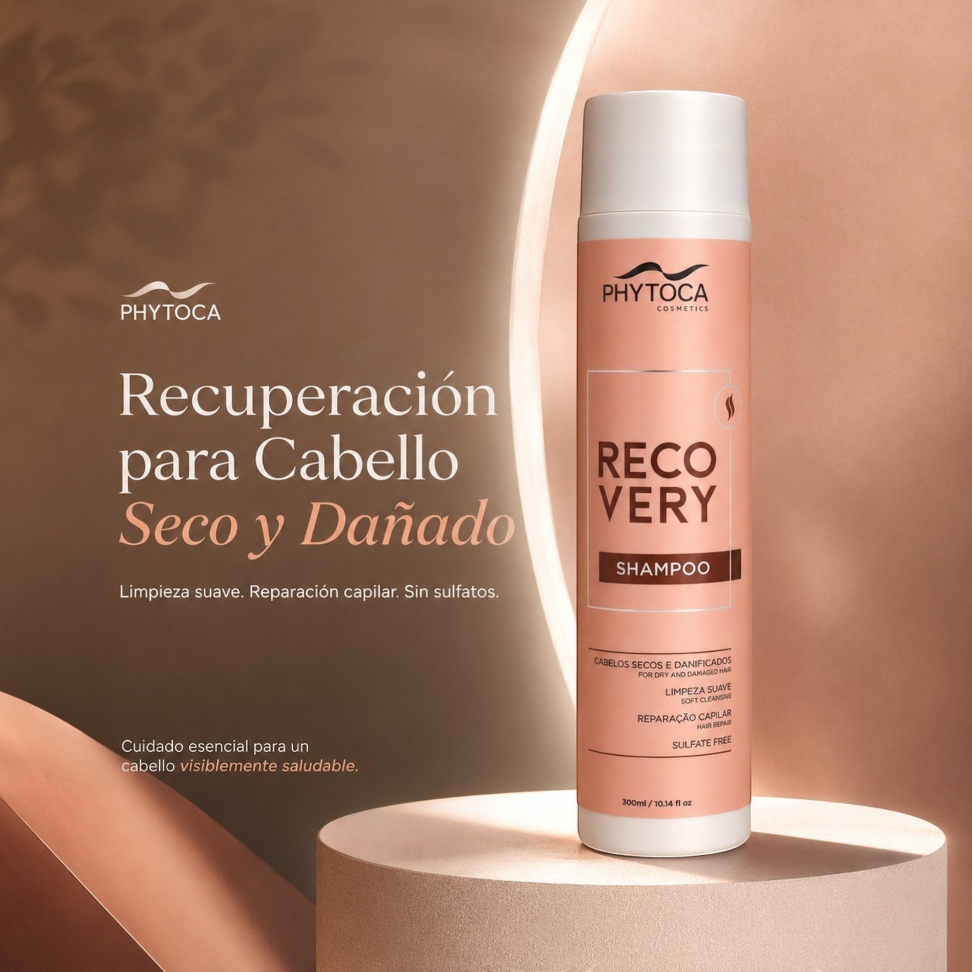 Champú Phytoca USA Recovery para cabello seco y dañado en envase rosa de 300 ml sobre pedestal circular